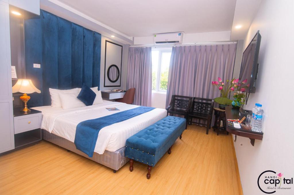 Postel nebo postele na pokoji v ubytování Hanoi Capital Premium Hotel