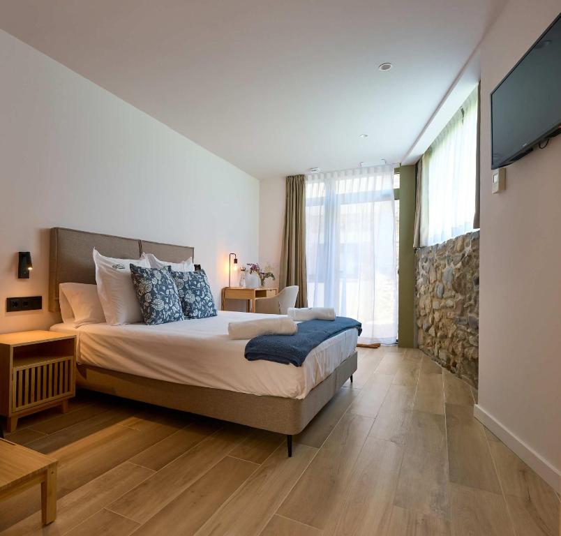 Postel nebo postele na pokoji v ubytování Hotel Molí Cardedeu