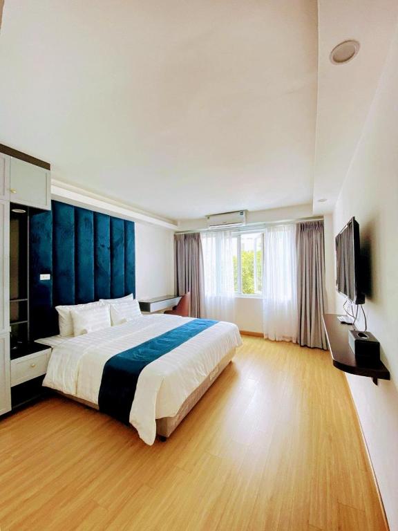 Postel nebo postele na pokoji v ubytování Hanoi Capital Premium Hotel