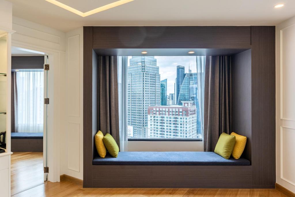 Postel nebo postele na pokoji v ubytování Rembrandt Hotel Bangkok