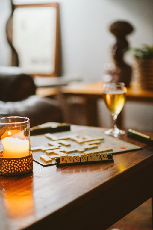 a table with a candle and a glass of wine at Makongo Hills Lodge in Magudu