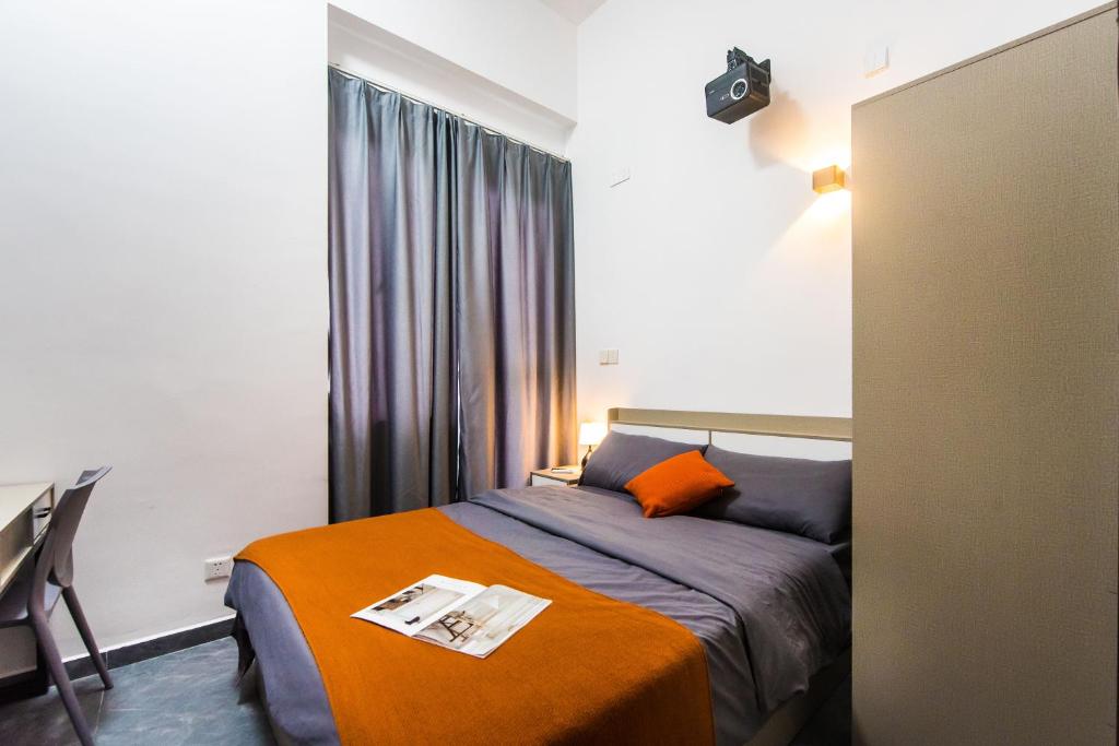 Postel nebo postele na pokoji v ubytování WESU Apartment - Shenzhen Longhua Dalang Fashion Dalang Town Branch