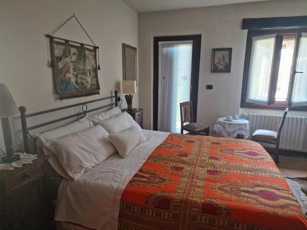 Postel nebo postele na pokoji v ubytování Ginetta