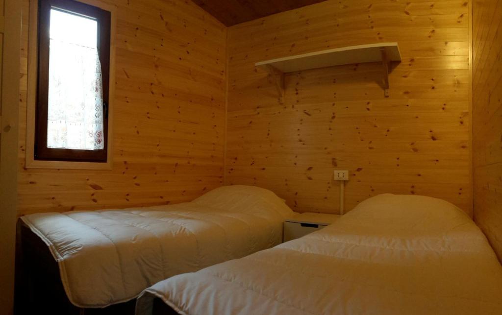 Postel nebo postele na pokoji v ubytování Camping Village Boscoblu'