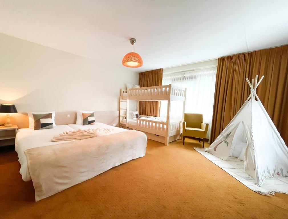 Postel nebo postele na pokoji v ubytování Hotel ReeHorst