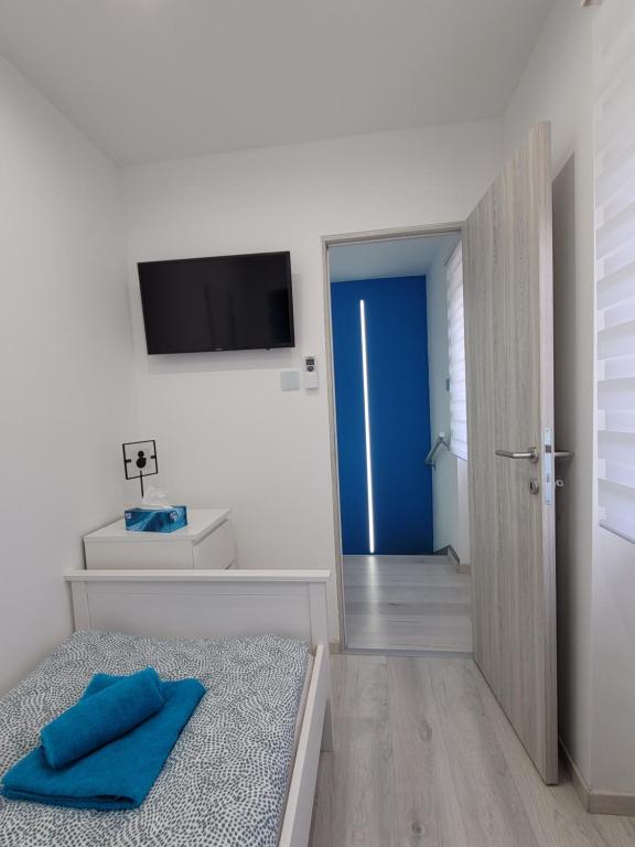 Postel nebo postele na pokoji v ubytování Blue Apartman