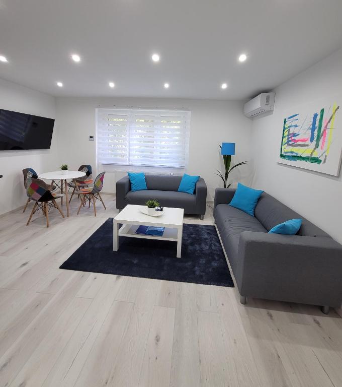 Posezení v ubytování Blue Apartman