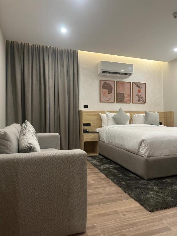 Postel nebo postele na pokoji v ubytování Lacasa Residence