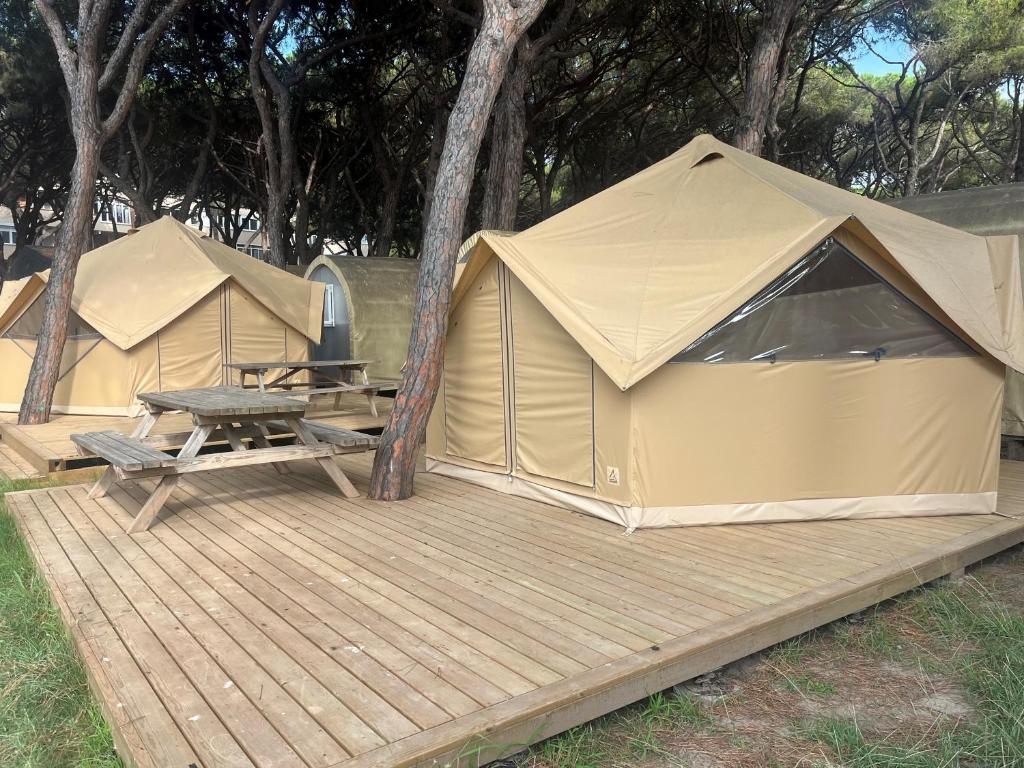 a couple of tents sitting on a wooden deck at Camping 3 Estrellas in Gavà