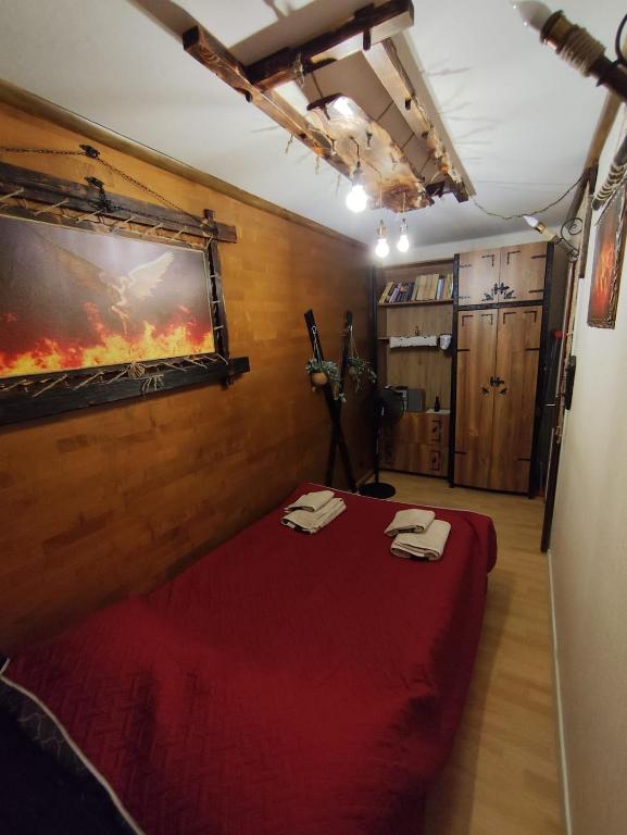 a room with a bed with two towels on it at Mroczne marzenie in Przemyśl