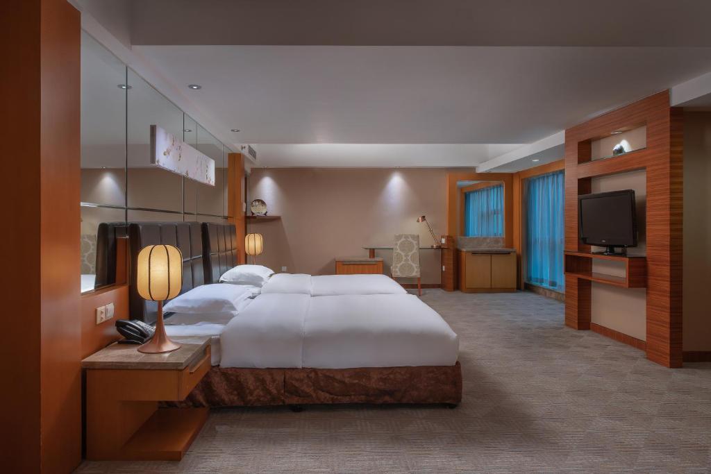 Postel nebo postele na pokoji v ubytování Empark Grand Hotel Xi'an