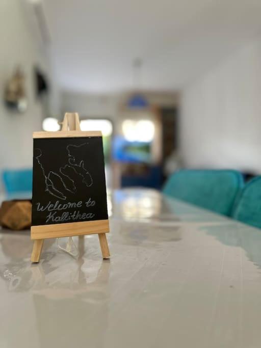 a chalkboard sign sitting on top of a table at House 77 in Kallithea Halkidikis