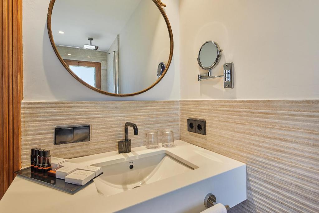 a bathroom with a sink and a mirror at Virrey Finca Hotel in Inca