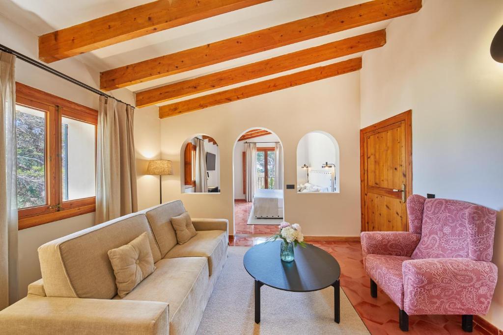 a living room with a couch and two chairs at Virrey Finca Hotel in Inca