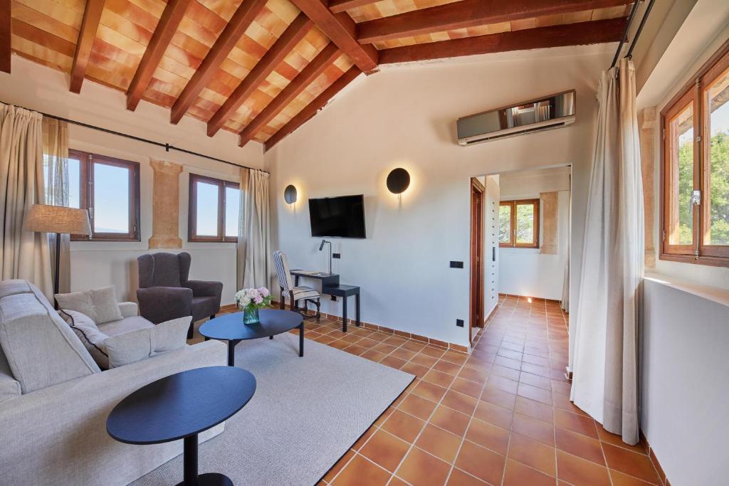 a living room with a couch and a table at Virrey Finca Hotel in Inca