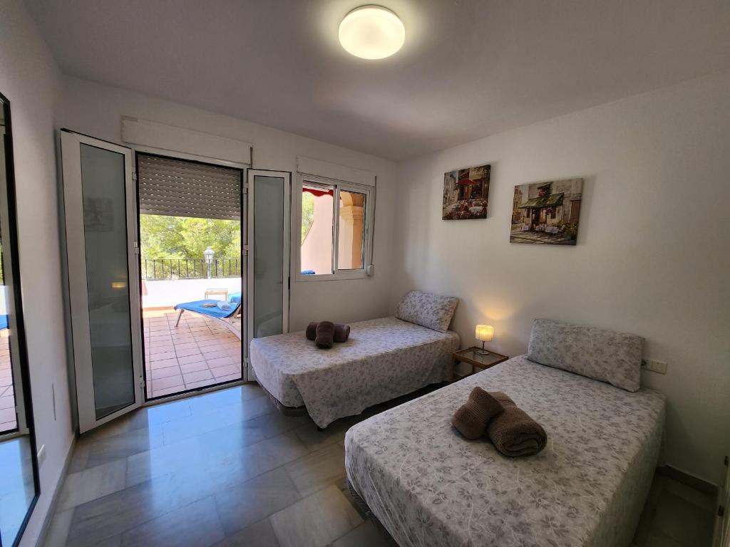 Posteľ alebo postele v izbe v ubytovaní Casa Lucena