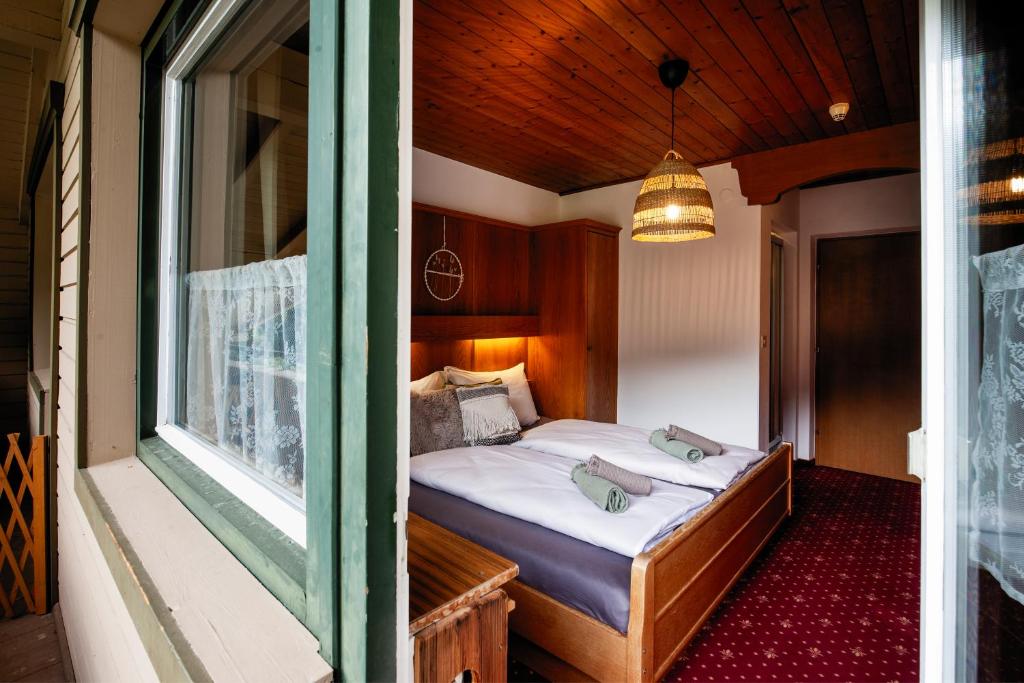 Postel nebo postele na pokoji v ubytování PineTree Lodge Mayrhofen