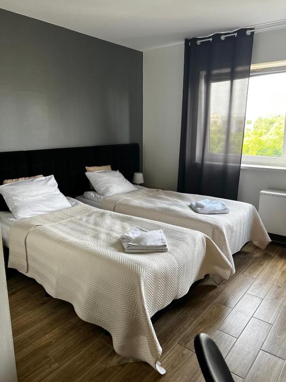 Posteľ alebo postele v izbe v ubytovaní Delta Apart-House