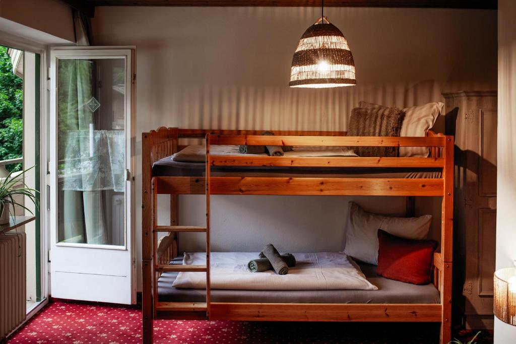 Postel nebo postele na pokoji v ubytování PineTree Lodge Mayrhofen