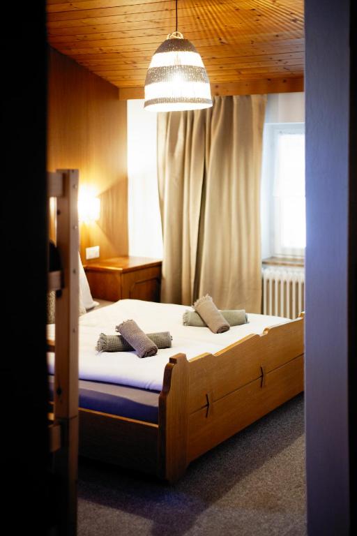 Postel nebo postele na pokoji v ubytování PineTree Lodge Mayrhofen