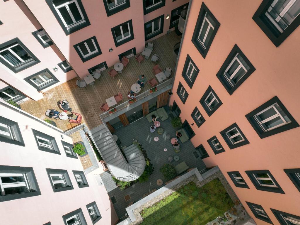an overhead view of a courtyard between two buildings at Hôtel Tandem - Boutique Hôtel in Strasbourg