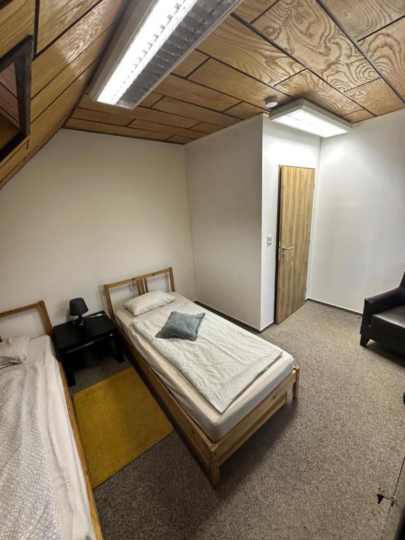 Postel nebo postele na pokoji v ubytování U Ztraceného potoka