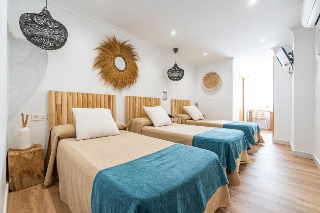 Cama o camas de una habitación en Hotel Las Américas