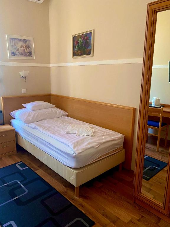 Postel nebo postele na pokoji v ubytování Pető Apartman