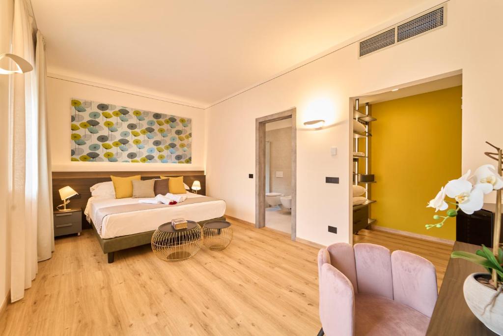 Postel nebo postele na pokoji v ubytování Hotel Villa Cuserina