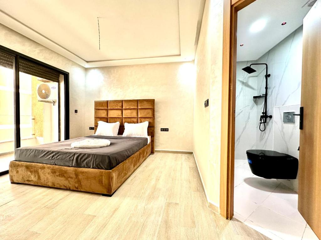Postel nebo postele na pokoji v ubytování appartment igar azougagh elhoceima