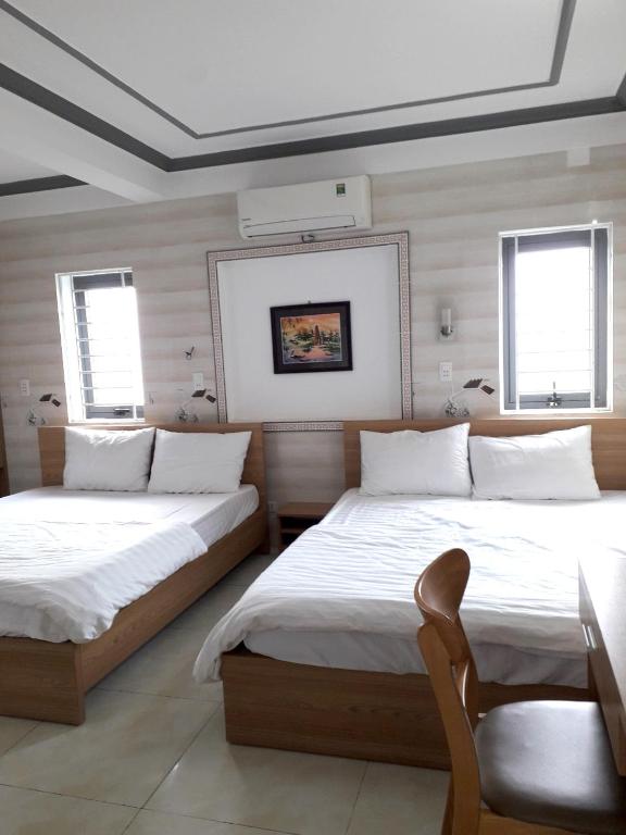 Postel nebo postele na pokoji v ubytování Nguyet Anh Guesthouse
