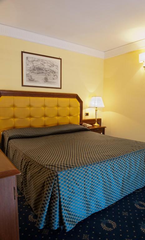 Postel nebo postele na pokoji v ubytování Hotel San Giorgio