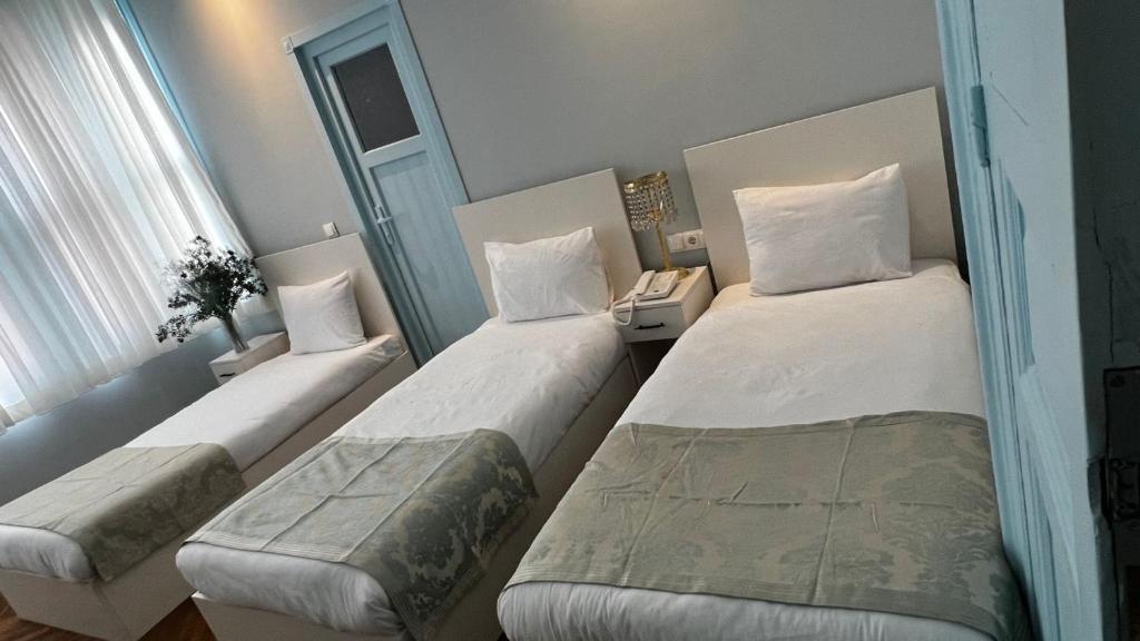 Postel nebo postele na pokoji v ubytování Bali Star City Hotel