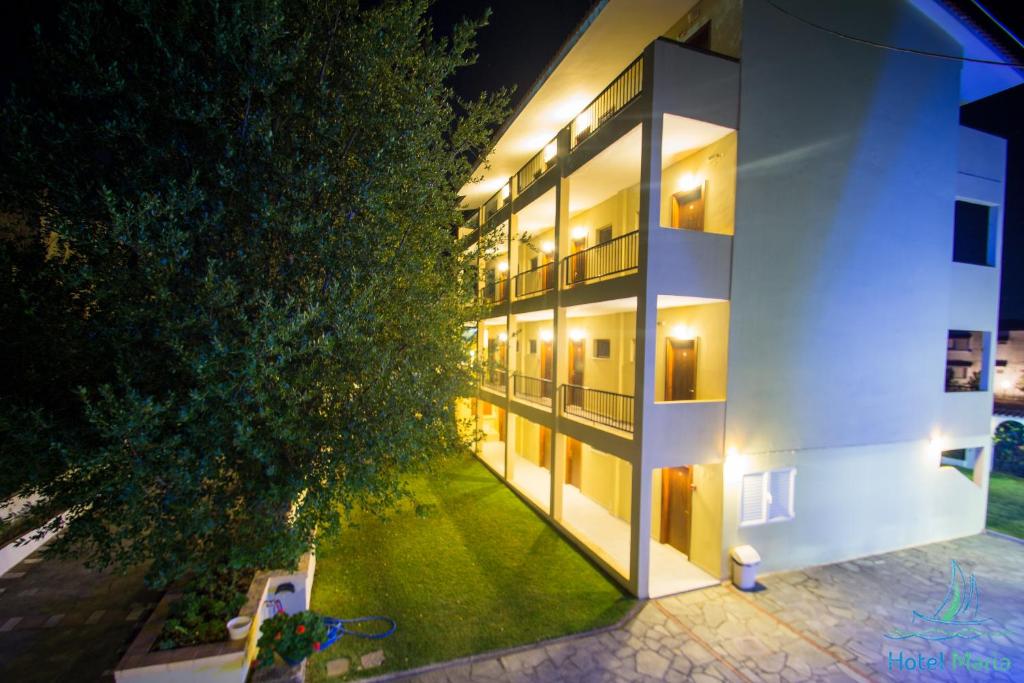 an external view of a building at night at Hotel Maria in Possidi