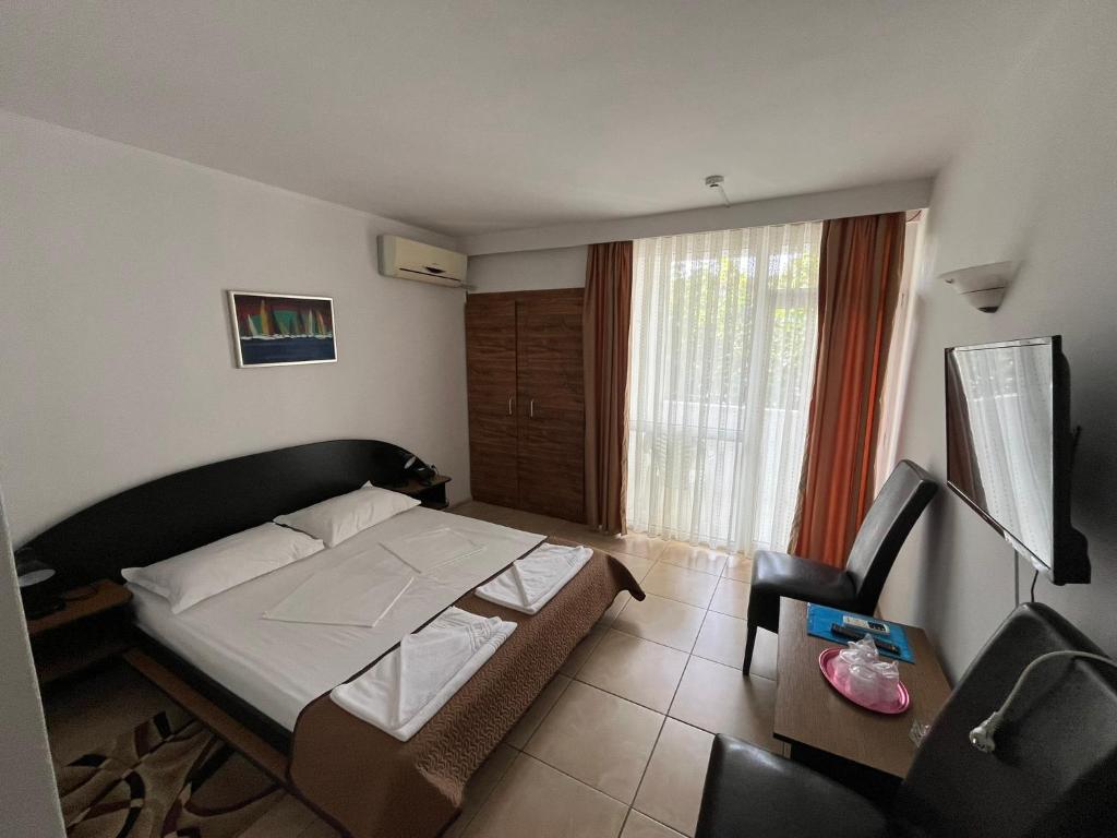 Postel nebo postele na pokoji v ubytování Hotel Metropol