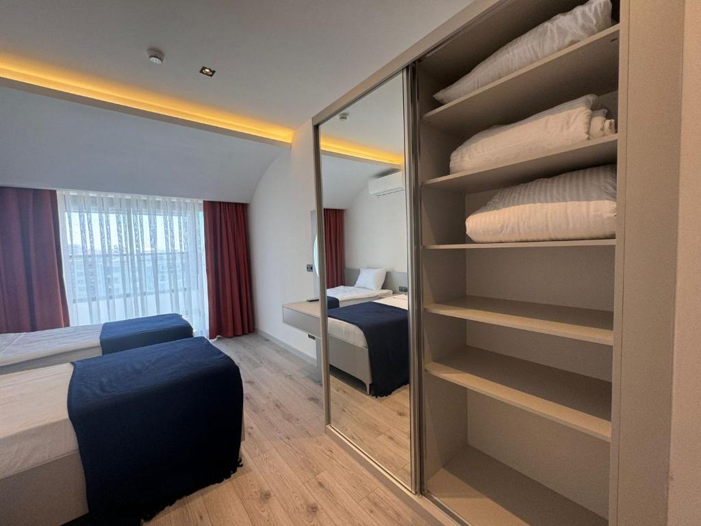 Postel nebo postele na pokoji v ubytování Ulu Panorama Residence