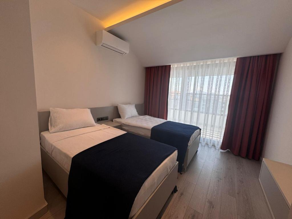 Postel nebo postele na pokoji v ubytování Ulu Panorama Residence