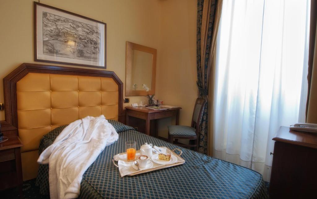Postel nebo postele na pokoji v ubytování Hotel San Giorgio
