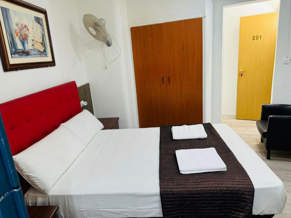 Postel nebo postele na pokoji v ubytování Hostal Mont Thabor