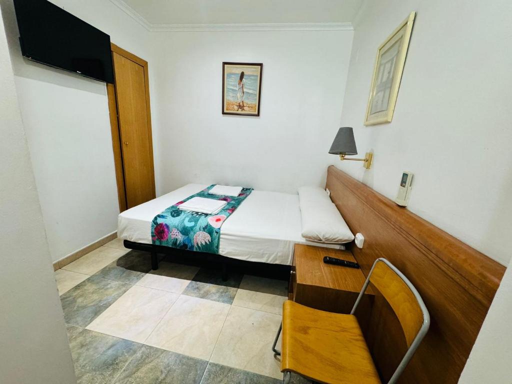 Postel nebo postele na pokoji v ubytování Hostal Mont Thabor