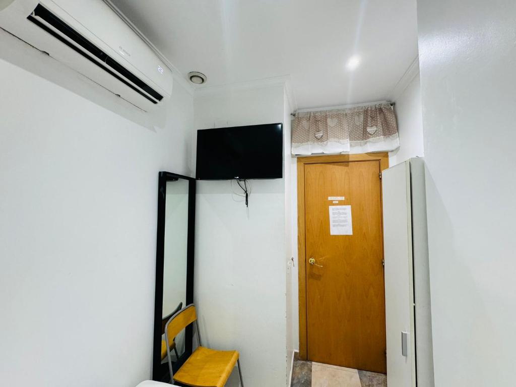 TV a/nebo společenská místnost v ubytování Hostal Mont Thabor