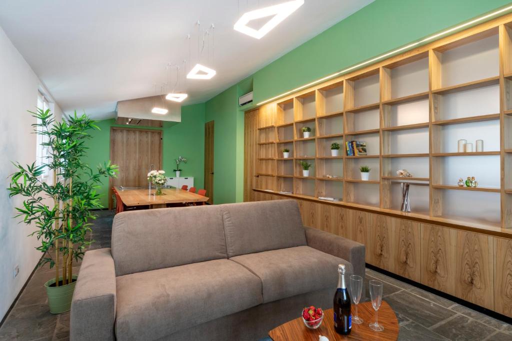 a living room with a couch and a table at JOIVY Charming Portofino 3-bed retreat in Portofino