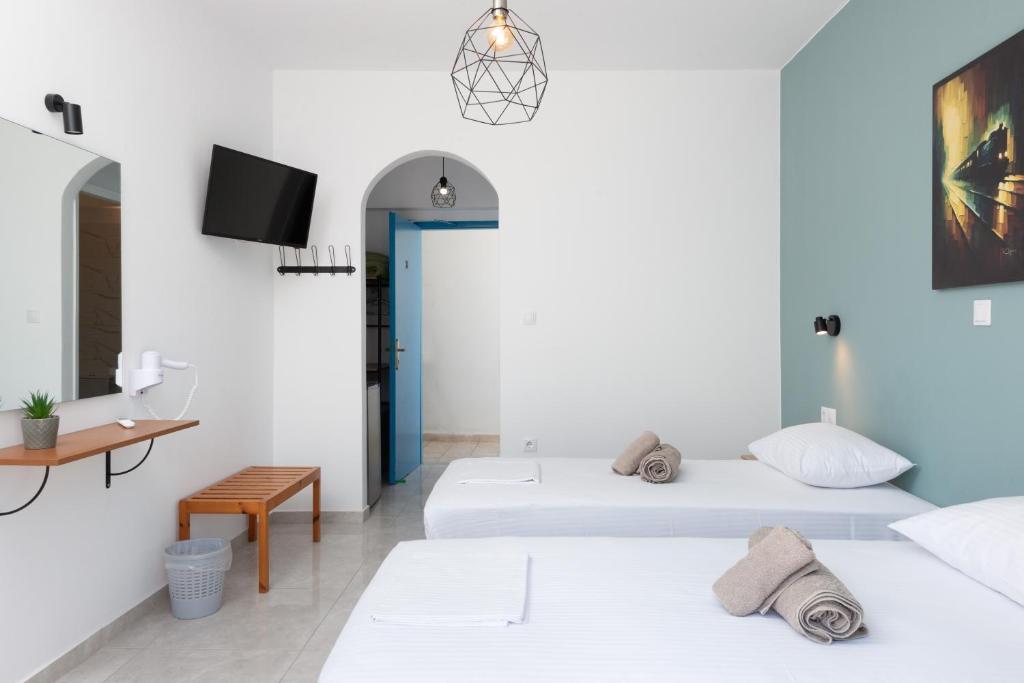 Posteľ alebo postele v izbe v ubytovaní Aratos Hotel