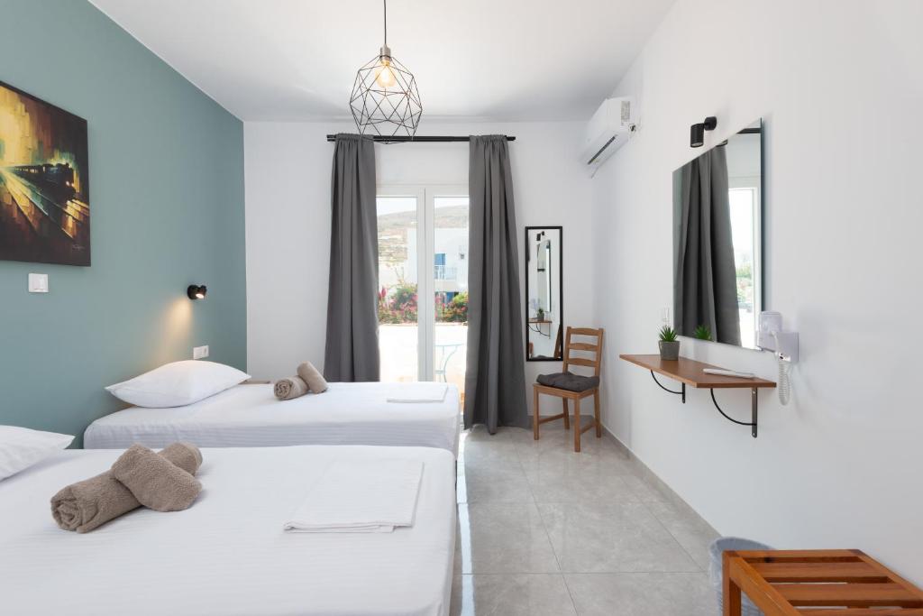 Posteľ alebo postele v izbe v ubytovaní Aratos Hotel