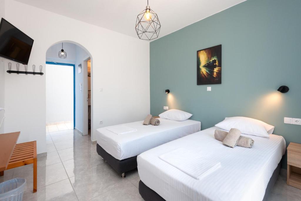 Posteľ alebo postele v izbe v ubytovaní Aratos Hotel
