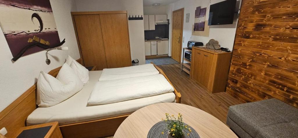 Televízia a/alebo spoločenská miestnosť v ubytovaní Appartement Mair