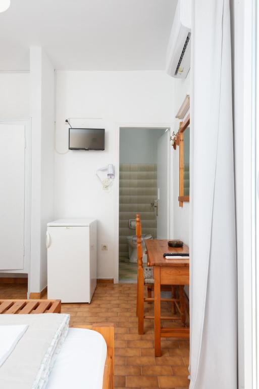 Posteľ alebo postele v izbe v ubytovaní Aratos Hotel