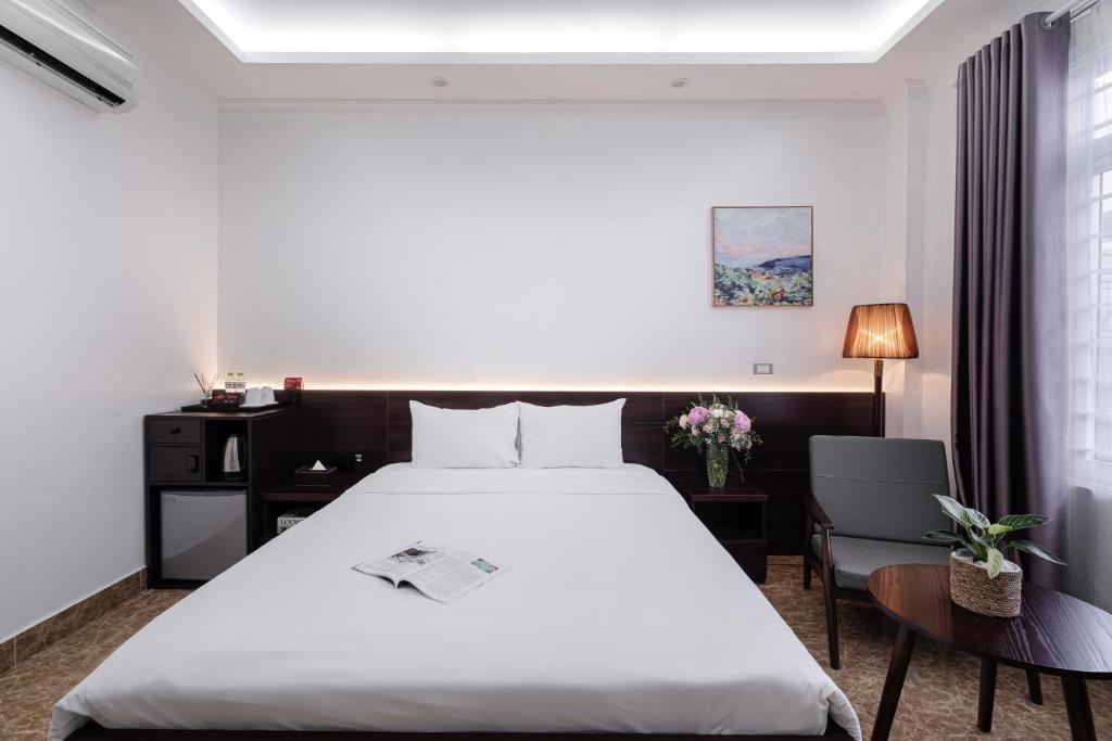 Postel nebo postele na pokoji v ubytování 그레이스 호텔 Grace Hotel & Residence