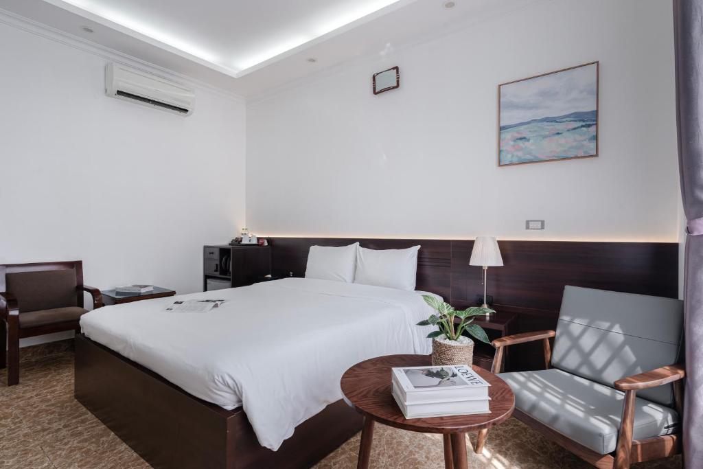 Postel nebo postele na pokoji v ubytování 그레이스 호텔 Grace Hotel & Residence