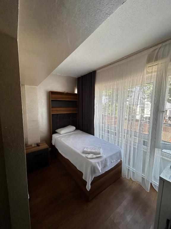 Postel nebo postele na pokoji v ubytování theblue suıt otel cafe restaurant
